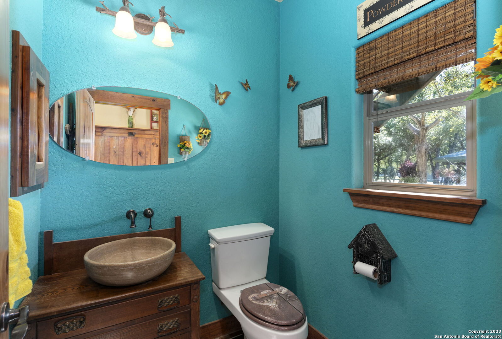 849 Madrona Ridge Drive Bandera, TX 78003 - Photo 18 of 44 a bathroom with a toilet and a sink