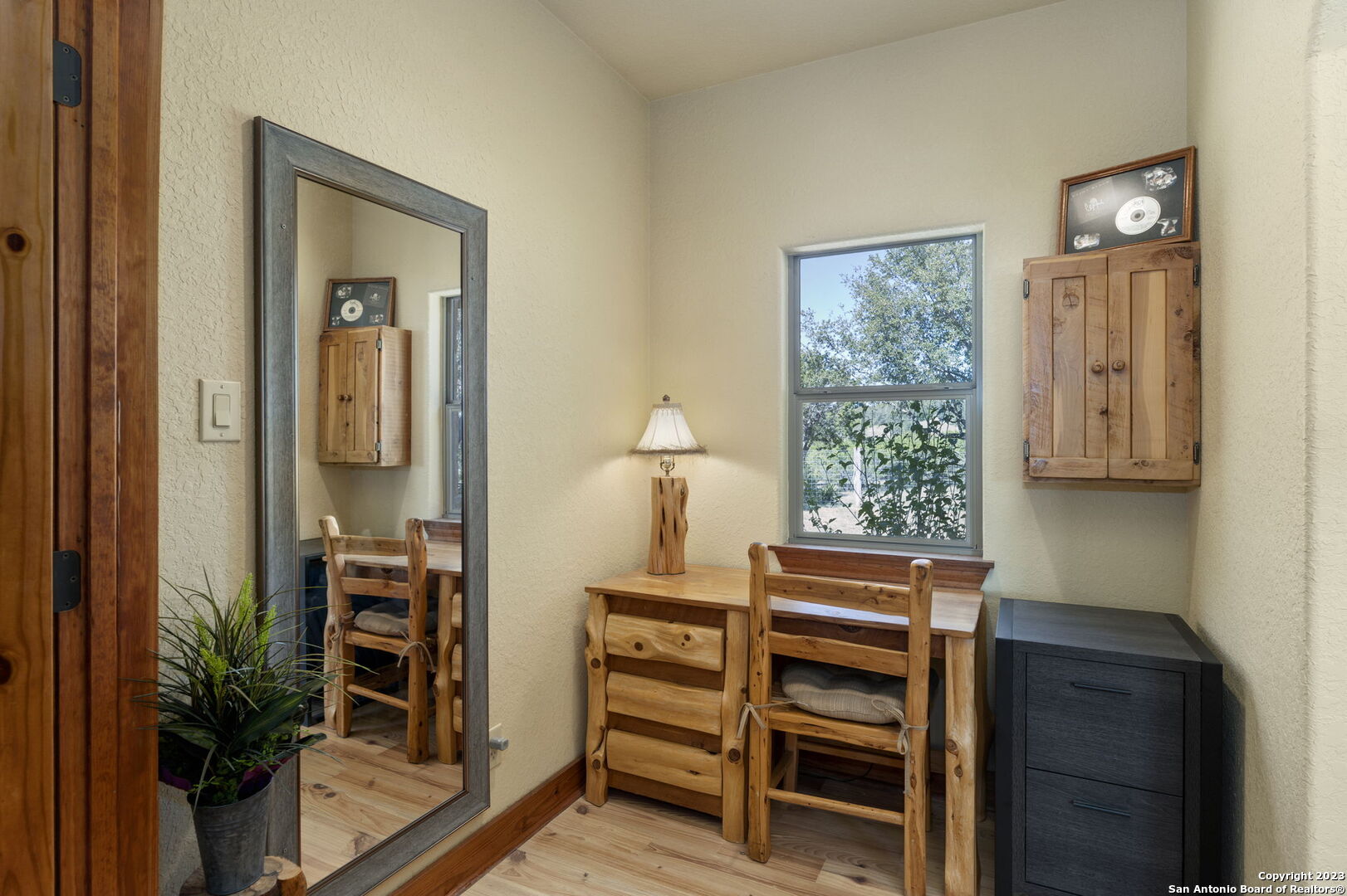 849 Madrona Ridge Drive Bandera, TX 78003 - Photo 19 of 44 a bedroom with a bed and a window