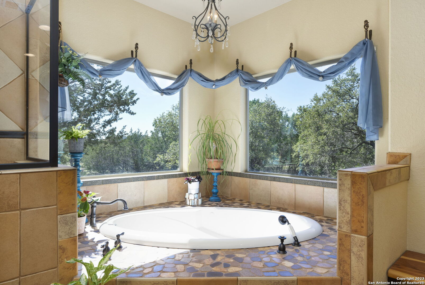 849 Madrona Ridge Drive Bandera, TX 78003 - Photo 24 of 44 a bed sitting in a balcony next to a window