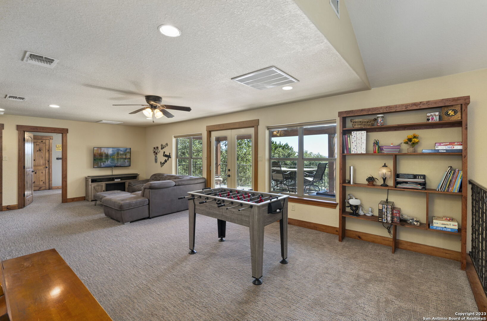 849 Madrona Ridge Drive Bandera, TX 78003 - Photo 26 of 44 a living room with furniture and a flat screen tv