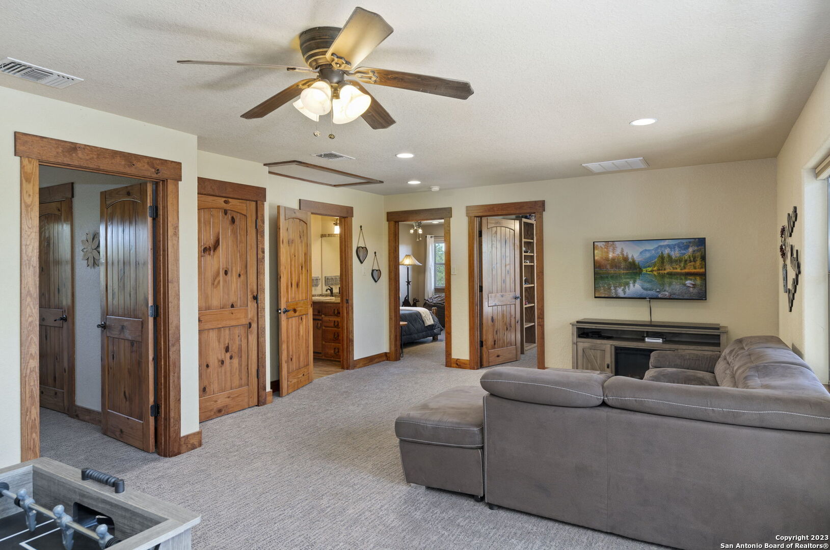 849 Madrona Ridge Drive Bandera, TX 78003 - Photo 27 of 44 a living room with furniture and a ceiling fan