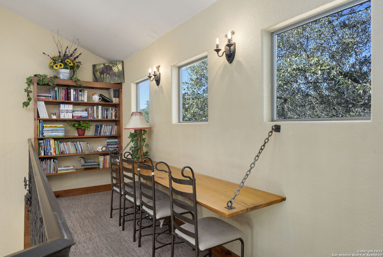 849 Madrona Ridge Drive Bandera, TX 78003 - Photo 28 of 44 a view of a workspace with furniture and a bookshelf