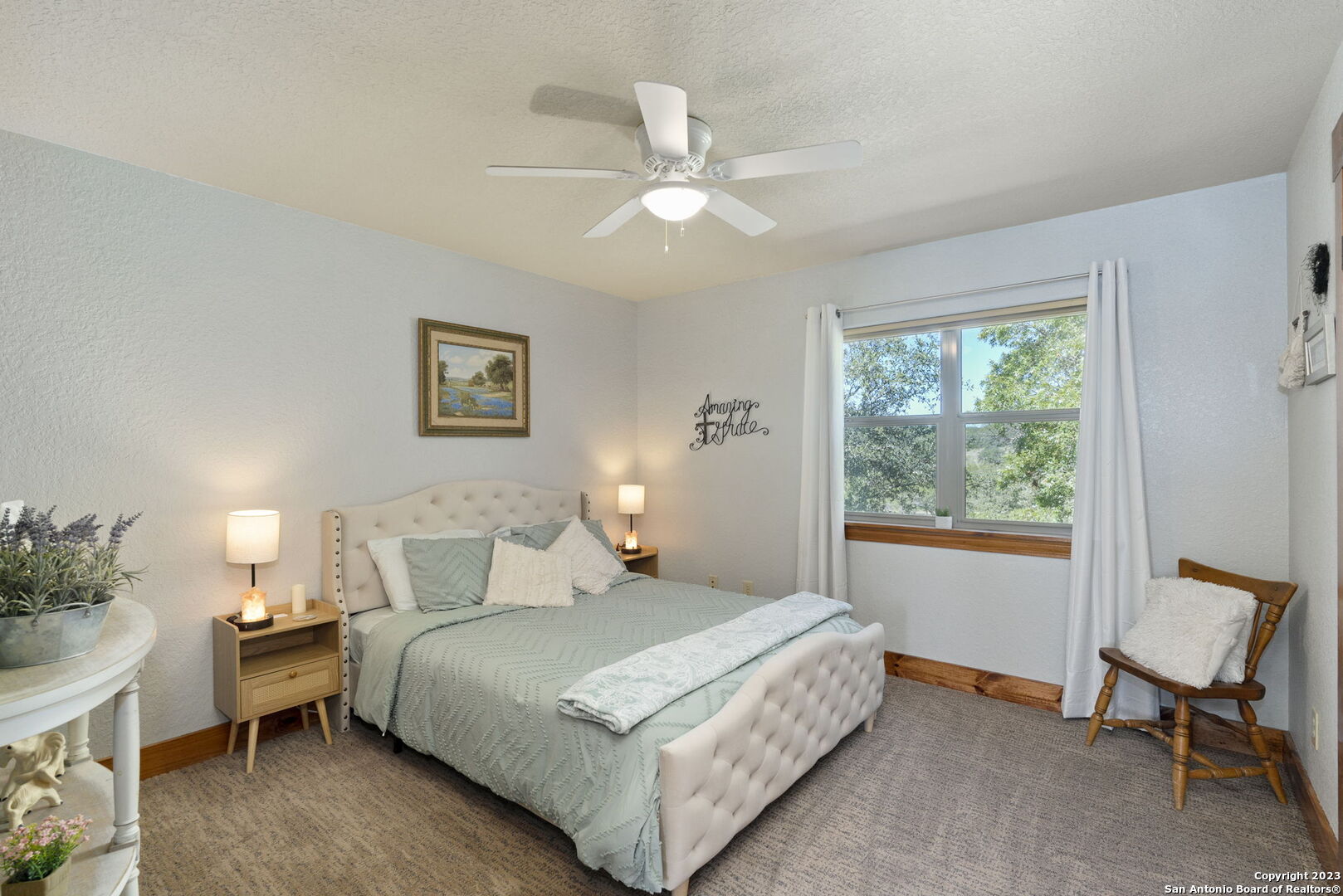 849 Madrona Ridge Drive Bandera, TX 78003 - Photo 29 of 44 a bedroom with a bed and a window