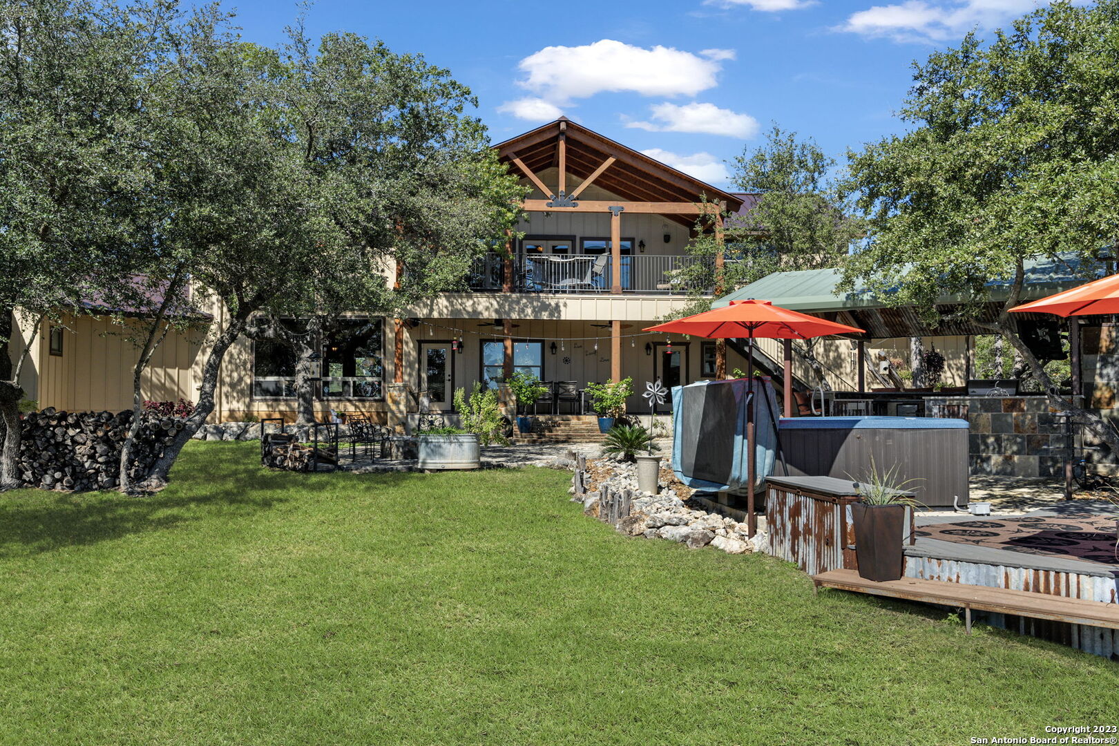 849 Madrona Ridge Drive Bandera, TX 78003 - Photo 3 of 44 a view of a house with a yard patio and furniture