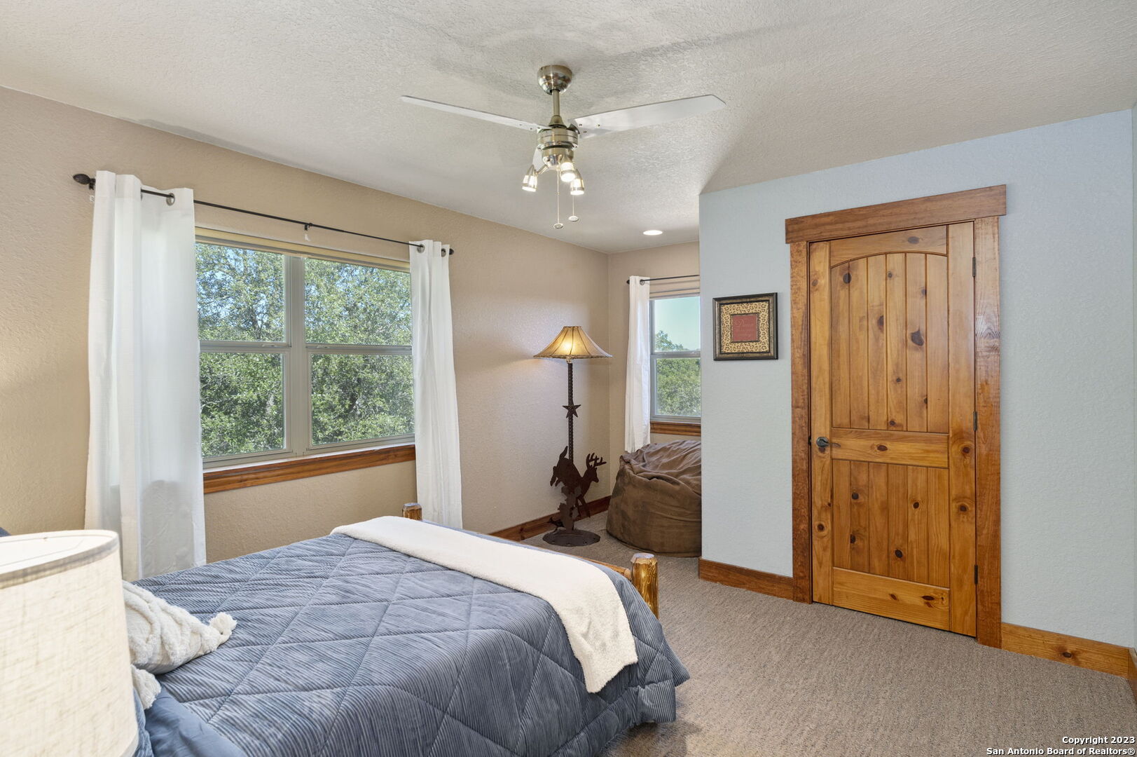 849 Madrona Ridge Drive Bandera, TX 78003 - Photo 31 of 44 a bed room with a bed and a window