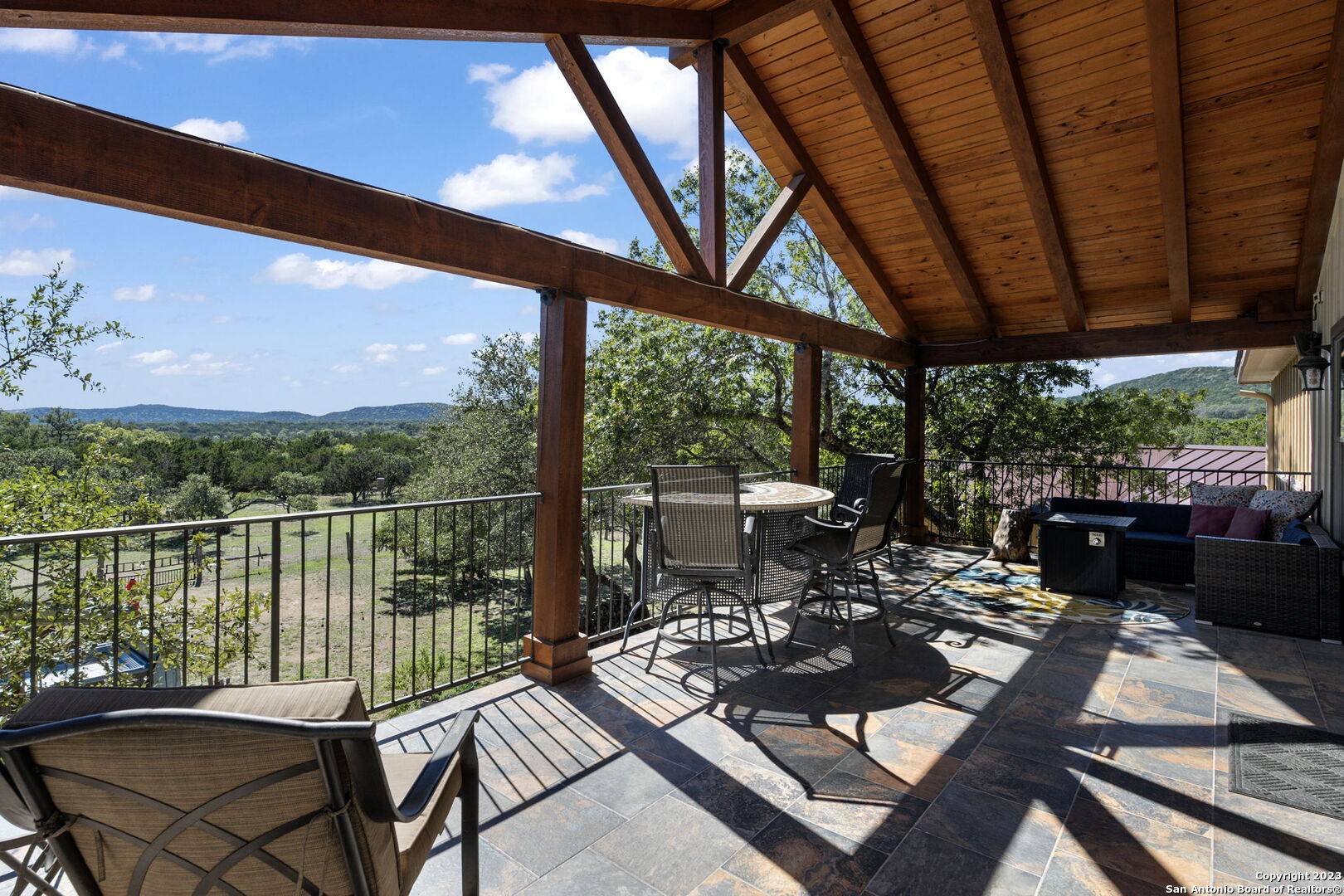 849 Madrona Ridge Drive Bandera, TX 78003 - Photo 33 of 44 a view of a patio with couches chairs and a table