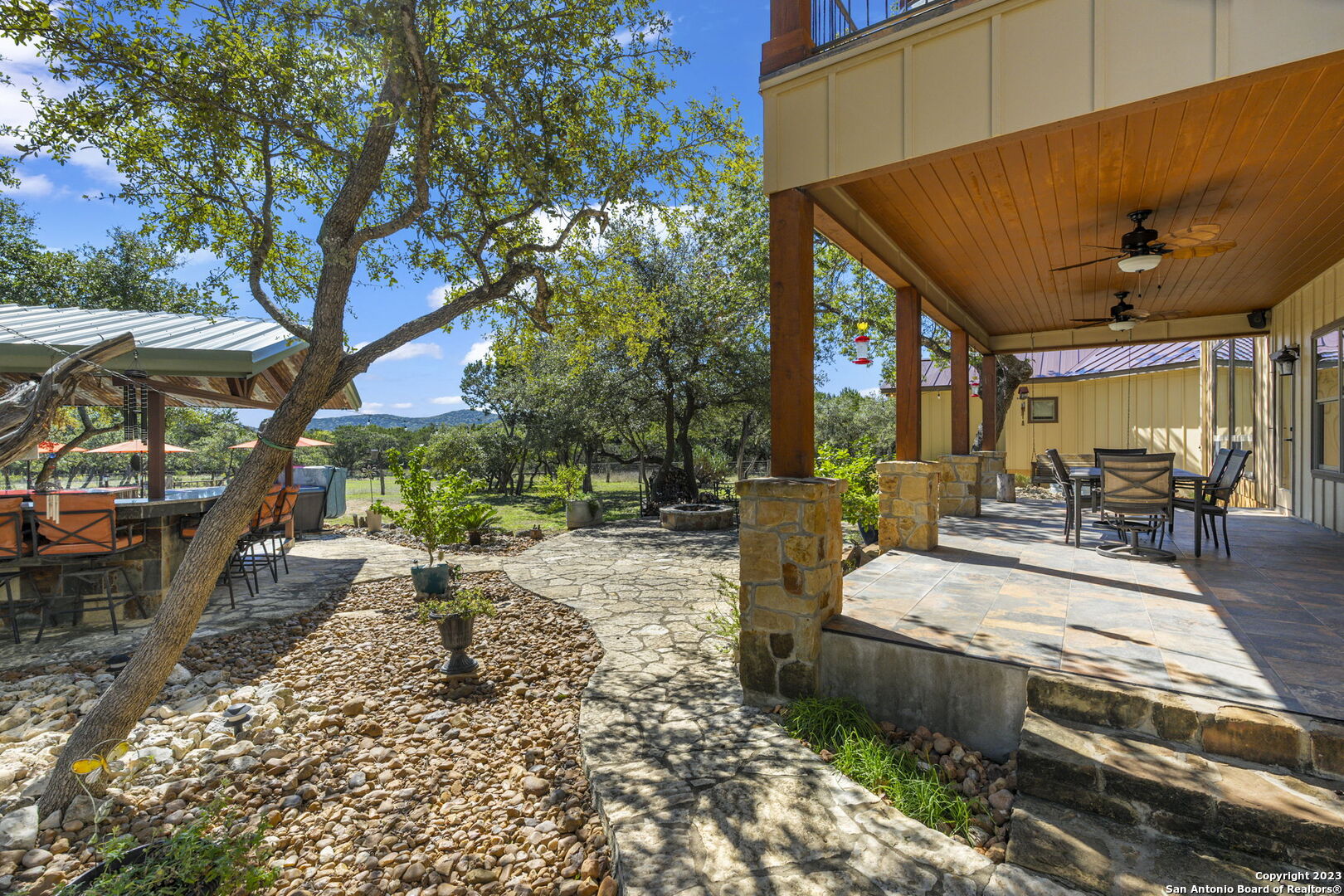 849 Madrona Ridge Drive Bandera, TX 78003 - Photo 34 of 44 a view of a backyard with sitting area