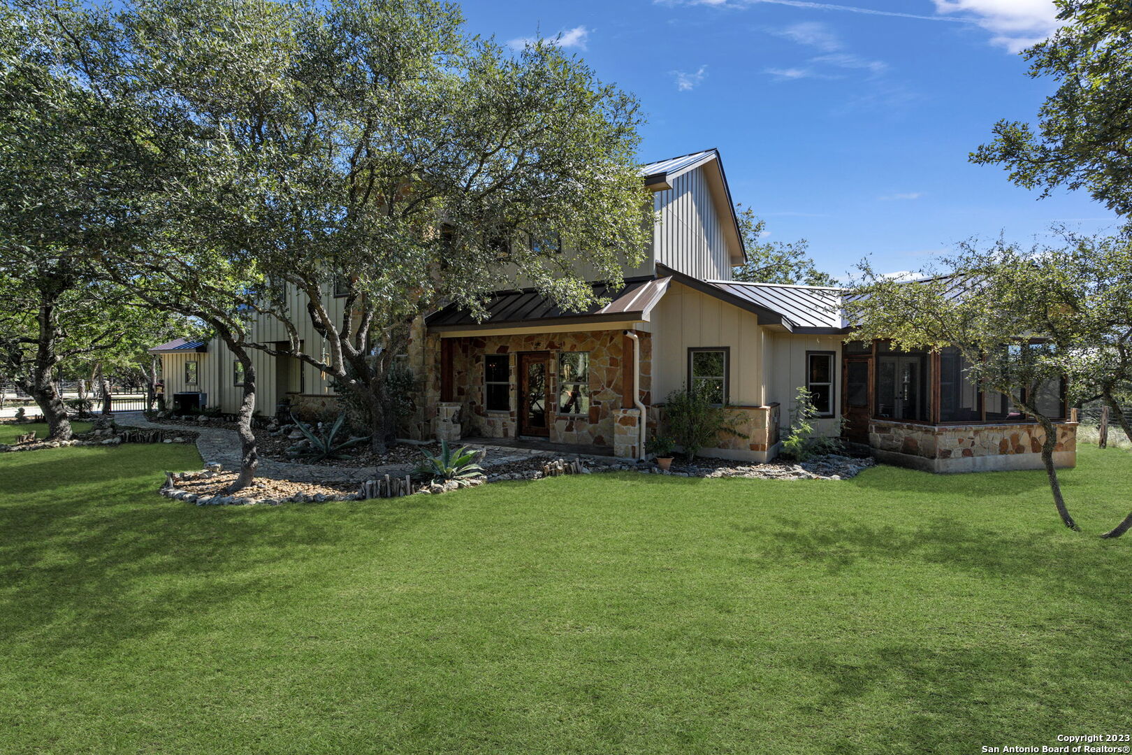 849 Madrona Ridge Drive Bandera, TX 78003 - Photo 4 of 44 a view of a house with a yard porch and sitting area