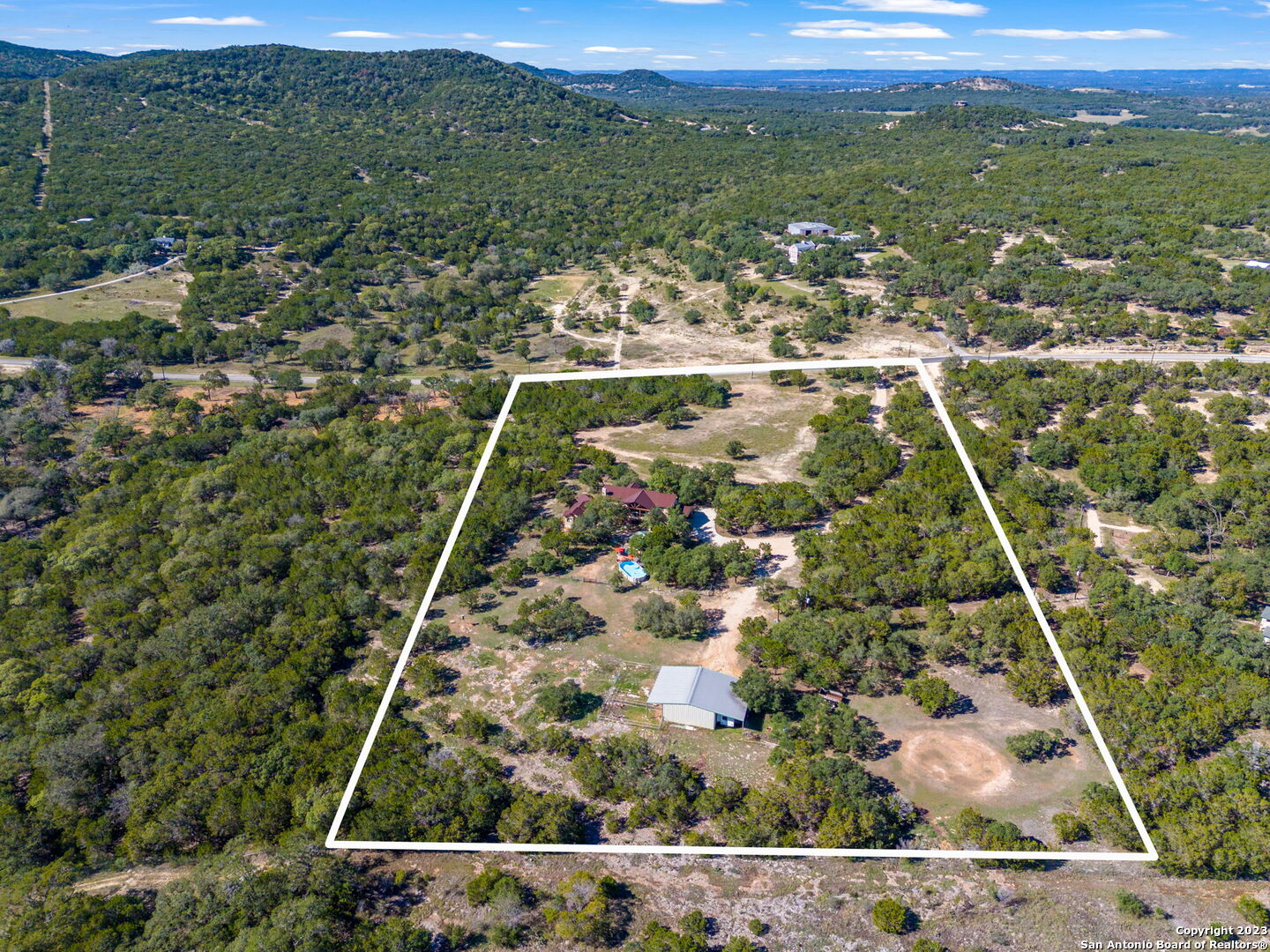 849 Madrona Ridge Drive Bandera, TX 78003 - Photo 44 of 44 an aerial view of residential houses with outdoor space