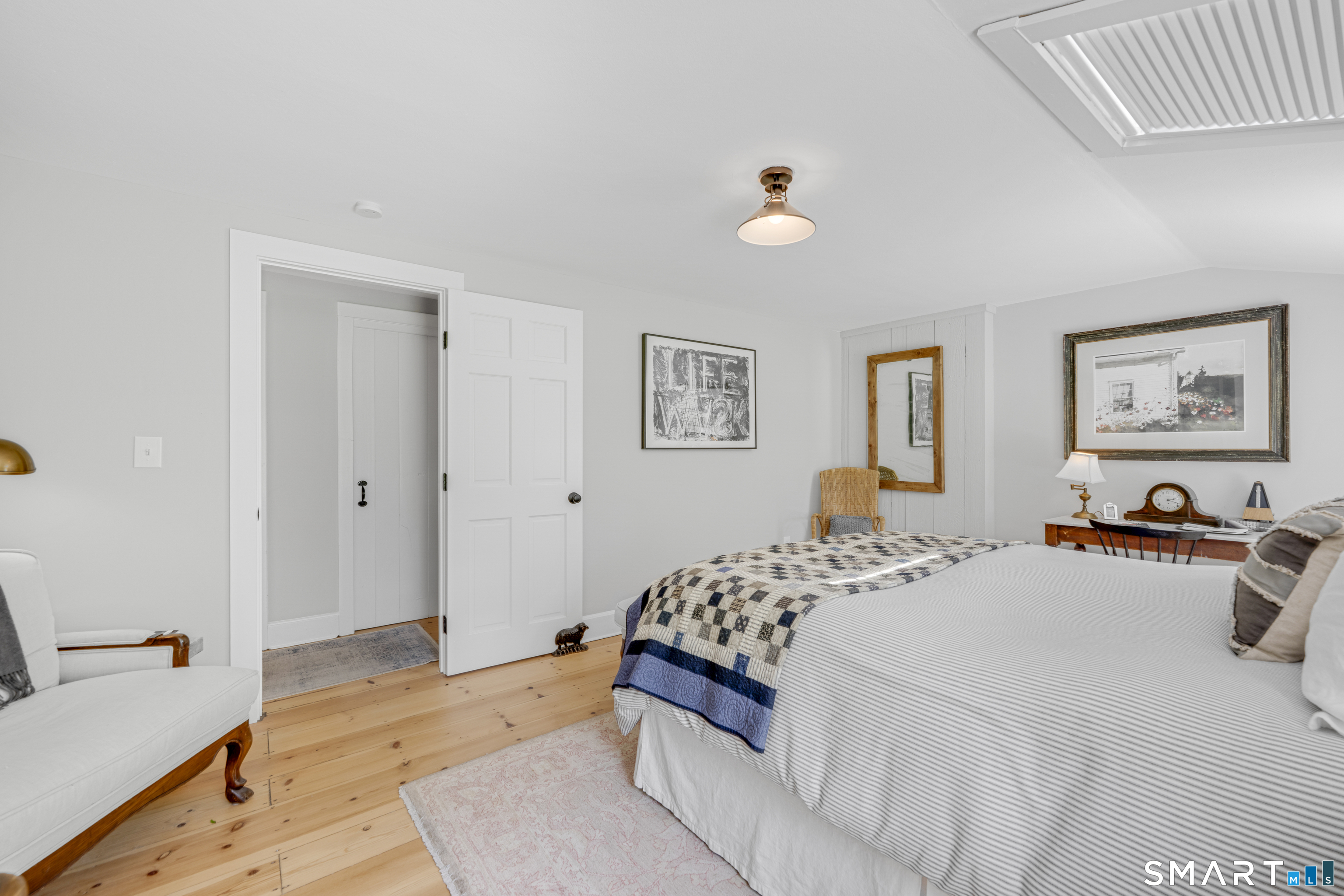 1000 Bassett Road Watertown, CT 06795 - Photo 23 of 35 a bedroom with a bed and painting on the wall