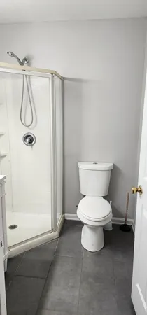 a bathroom with a bathtub and a toilet