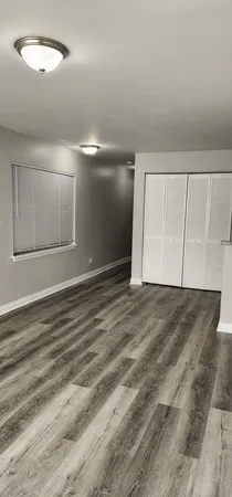 a kitchen with granite countertop a sink and a stove top oven