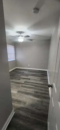 a bathroom with a sink vanity mirror and toilet