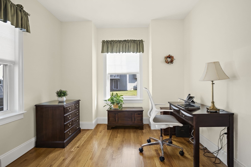 8 Winning Farm Road, Unit 8 Woburn, MA 01801 - Photo 13 of 42 a living room with furniture and a wooden floor