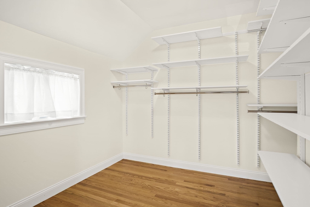 8 Winning Farm Road, Unit 8 Woburn, MA 01801 - Photo 20 of 42 a view of an empty room with wooden floor and a window