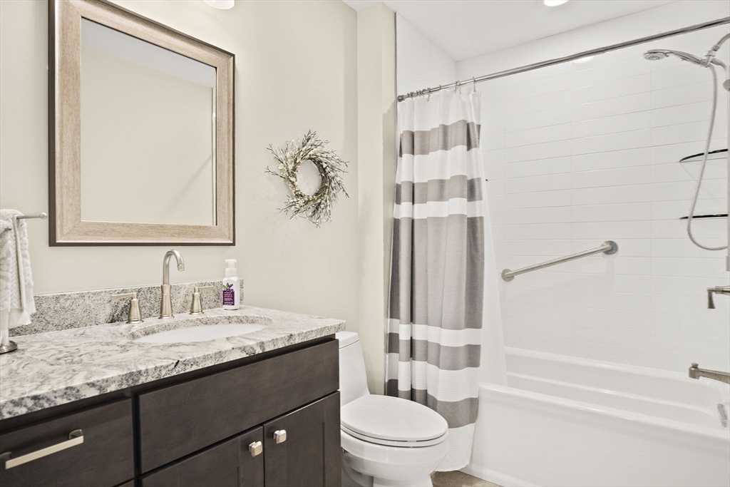 8 Winning Farm Road, Unit 8 Woburn, MA 01801 - Photo 26 of 42 a bathroom with a granite countertop sink toilet and shower