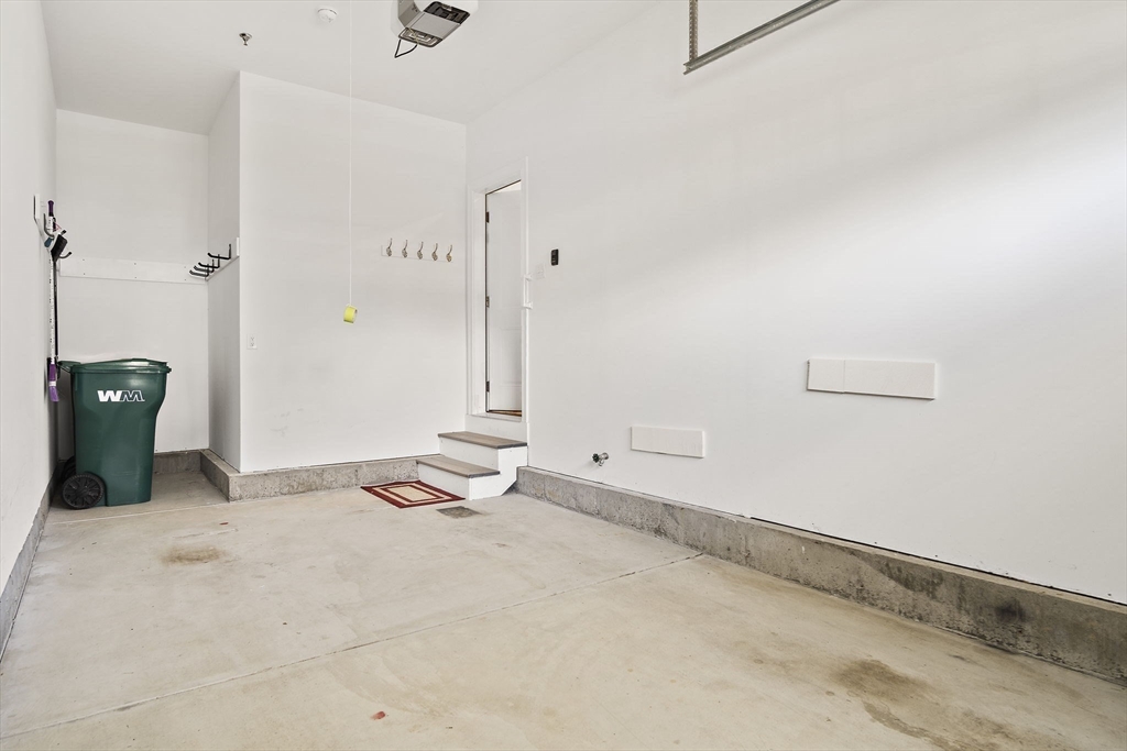 8 Winning Farm Road, Unit 8 Woburn, MA 01801 - Photo 29 of 42 a view of a room with an empty space and mirror