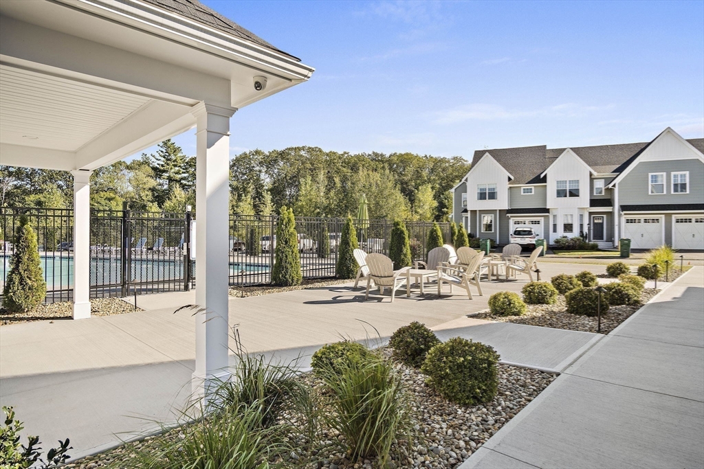 8 Winning Farm Road, Unit 8 Woburn, MA 01801 - Photo 40 of 42 a view of a house with backyard porch and sitting area