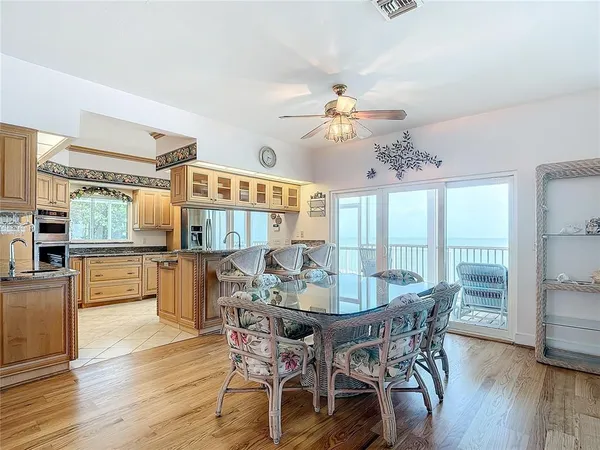 a kitchen with stainless steel appliances granite countertop a sink and a stove
