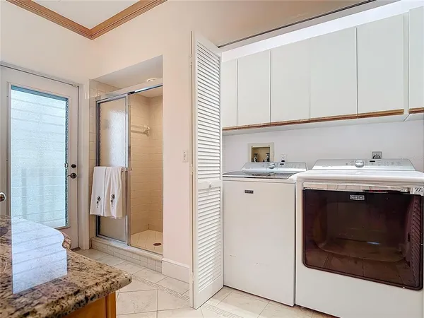 a kitchen with a sink and a refrigerator