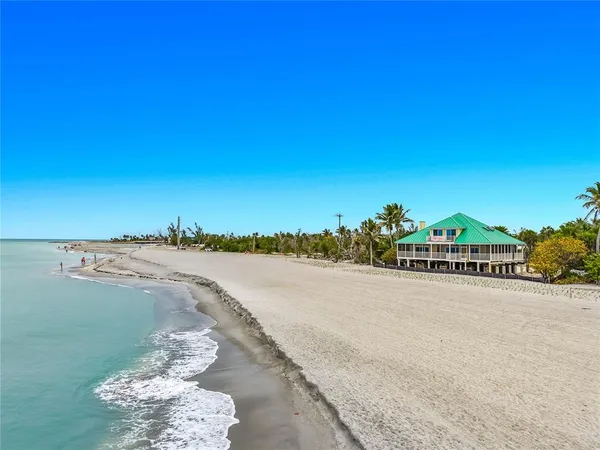 a view of an ocean beach and a city view
