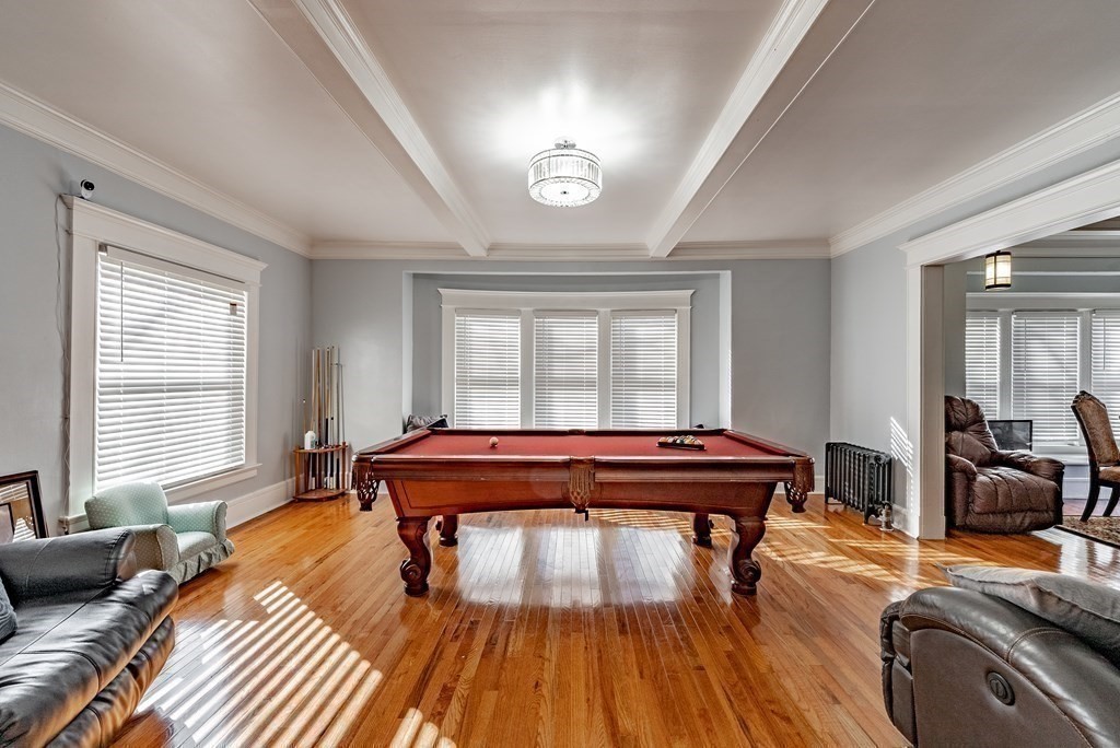 6 Maplewood Terrace Springfield, MA 01108 - Photo 8 of 24 a living room with a couch and wooden floor