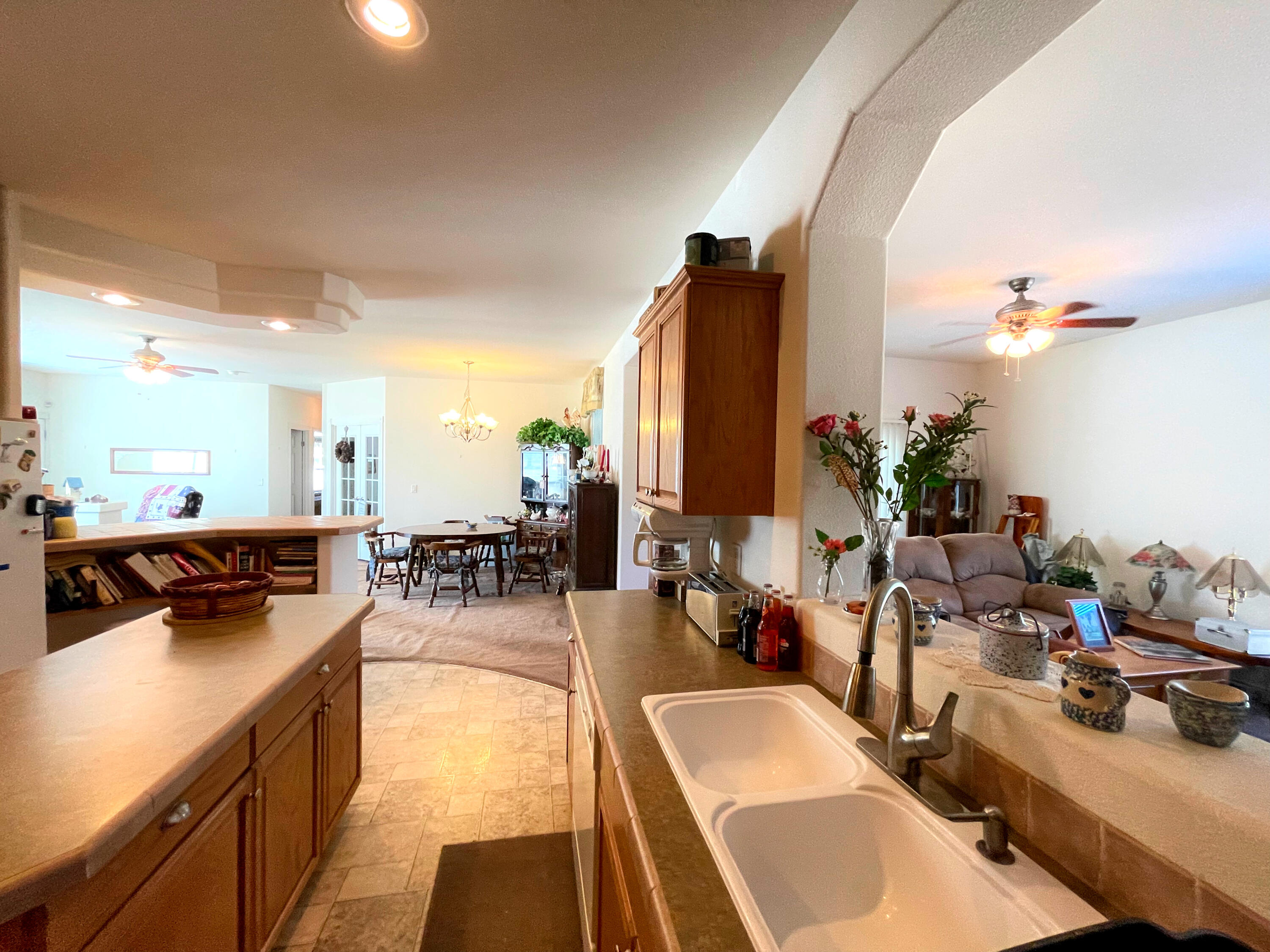 4911 Rockydale Road Cave Junction, OR 97523 - Photo 14 of 25 a kitchen with a sink a counter and chairs