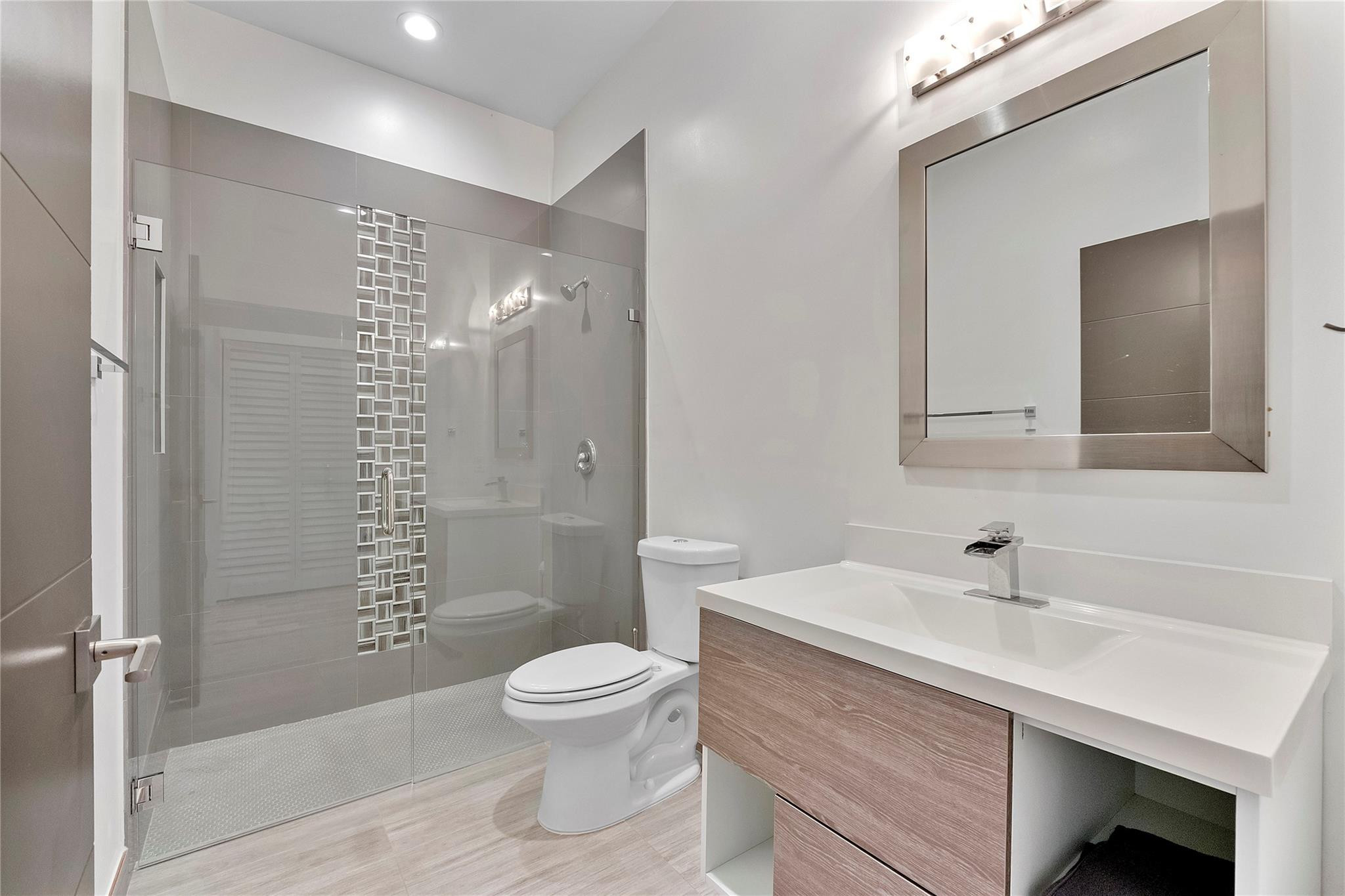 5351 Godfrey Road Parkland, FL 33067 - Photo 64 of 95 a bathroom with a sink a toilet and shower