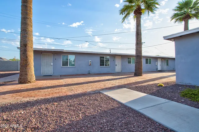 a front view of a house with yard