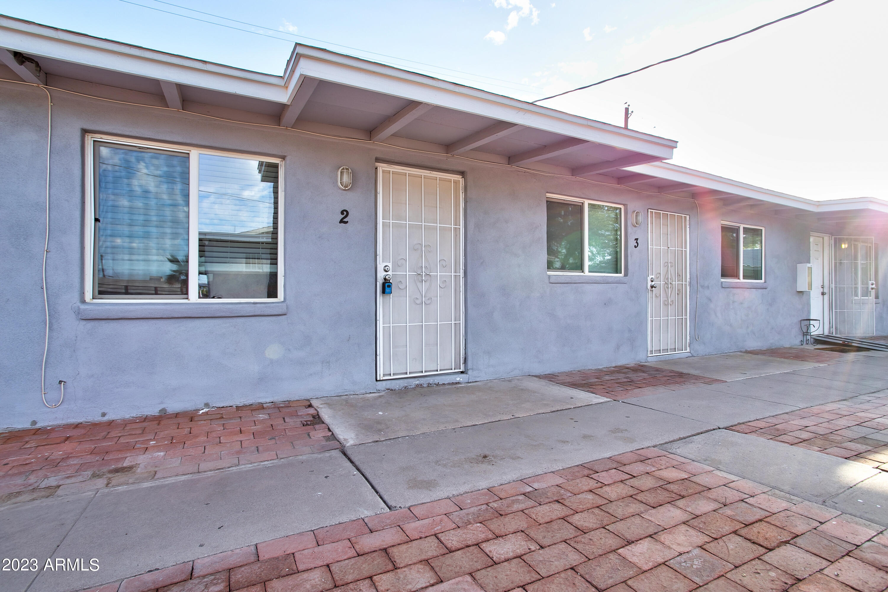 210 East Jones Avenue, Unit 2 Phoenix, AZ 85040 - Photo 14 of 27 a front view of a house with yard
