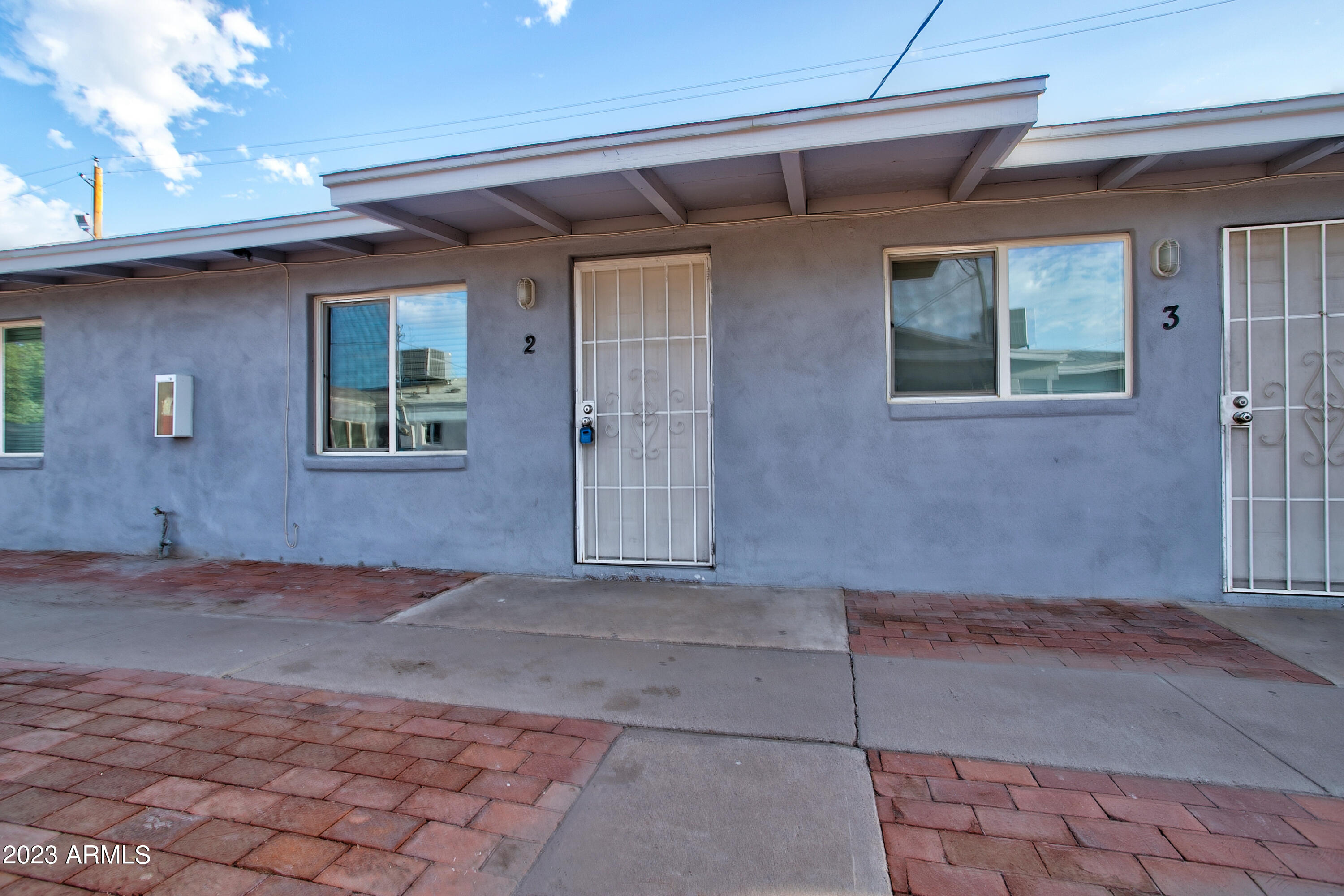 210 East Jones Avenue, Unit 2 Phoenix, AZ 85040 - Photo 15 of 27 a view of a house with a yard