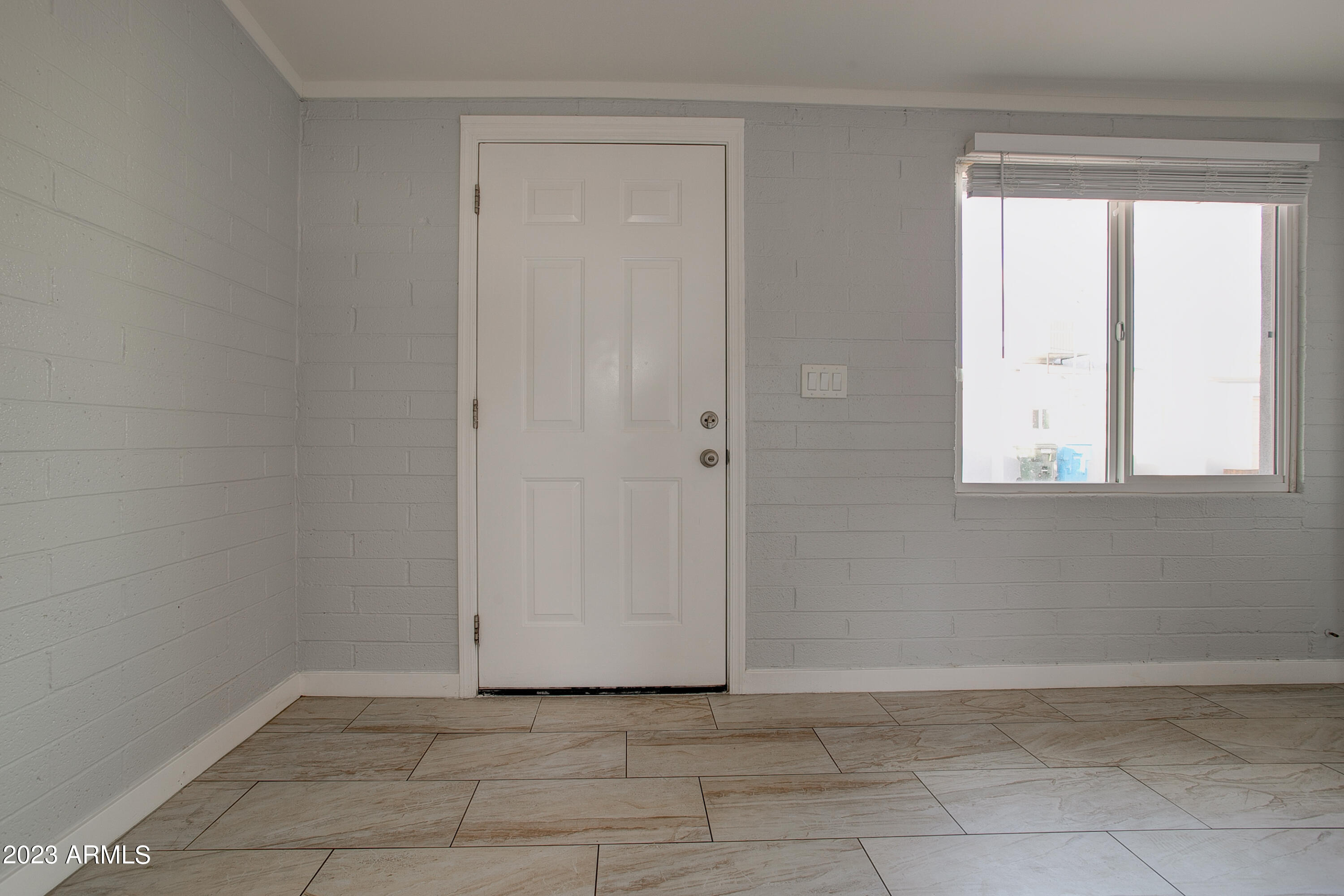 210 East Jones Avenue, Unit 2 Phoenix, AZ 85040 - Photo 18 of 27 a view of an empty room with a window