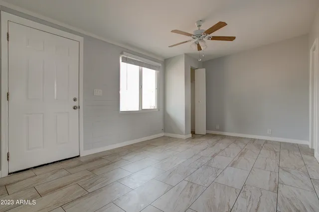 a view of an empty room with a window