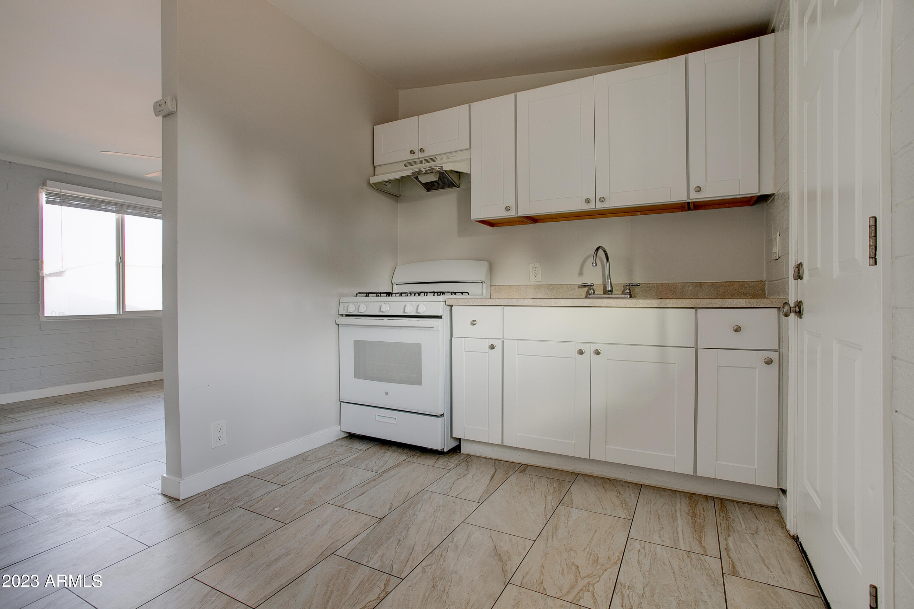 210 East Jones Avenue, Unit 2 Phoenix, AZ 85040 - Photo 21 of 27 a view of cabinets with wooden floor and cabinets
