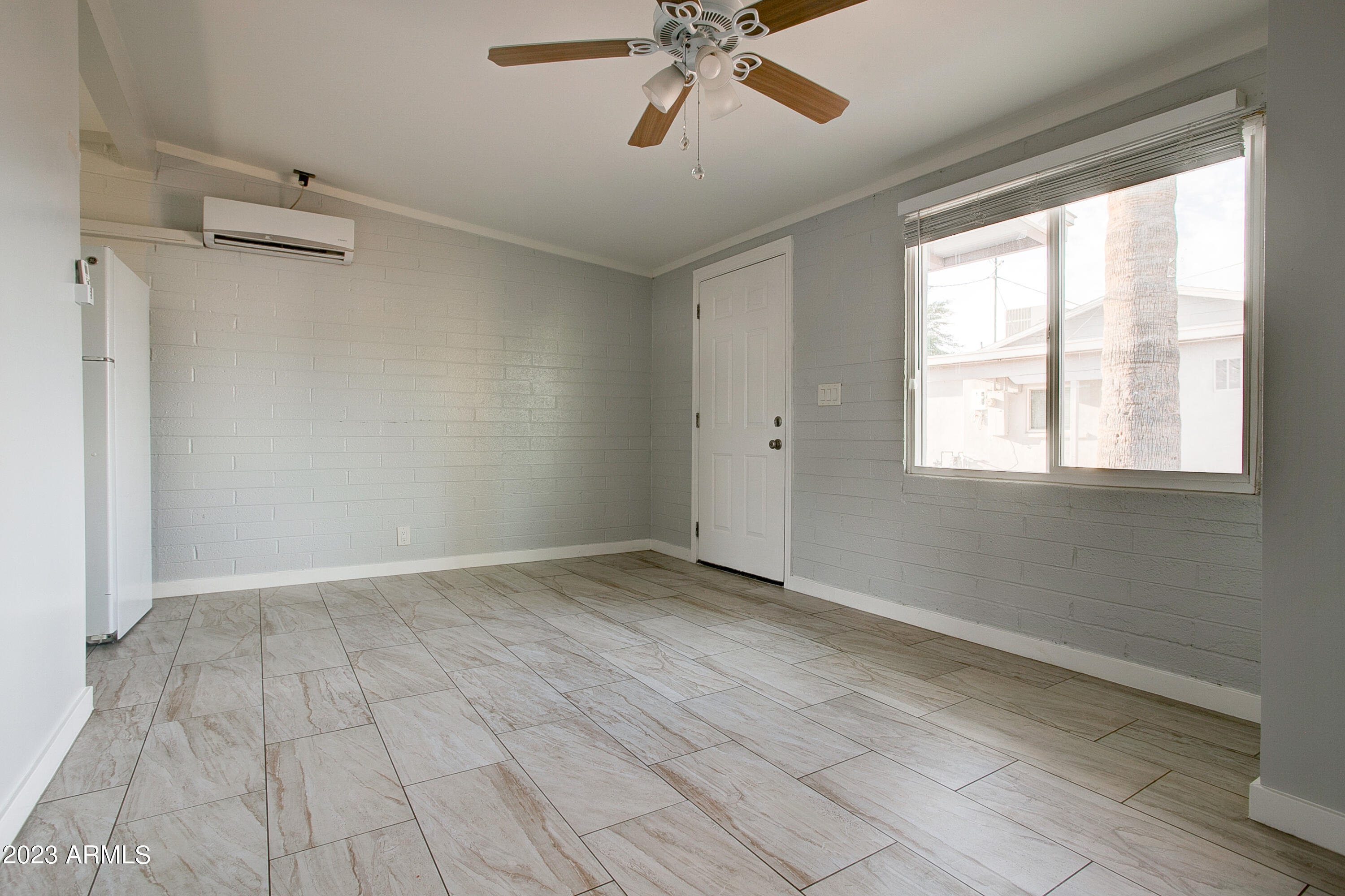 210 East Jones Avenue, Unit 2 Phoenix, AZ 85040 - Photo 22 of 27 a view of an empty room with a window