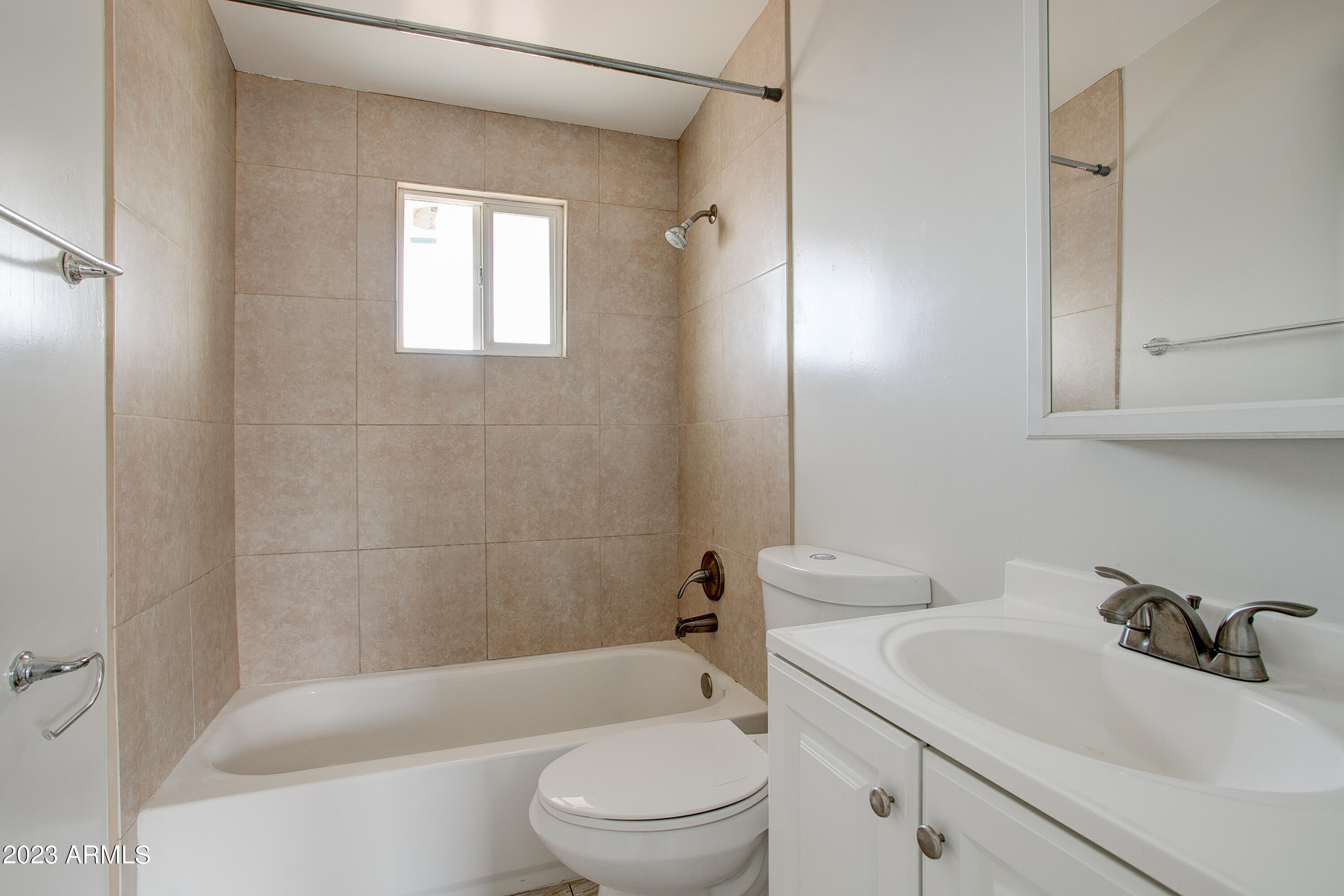 210 East Jones Avenue, Unit 2 Phoenix, AZ 85040 - Photo 23 of 27 a bathroom with a sink a toilet and shower