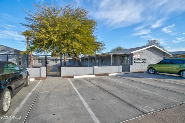 a view of house with outdoor space and sitting area