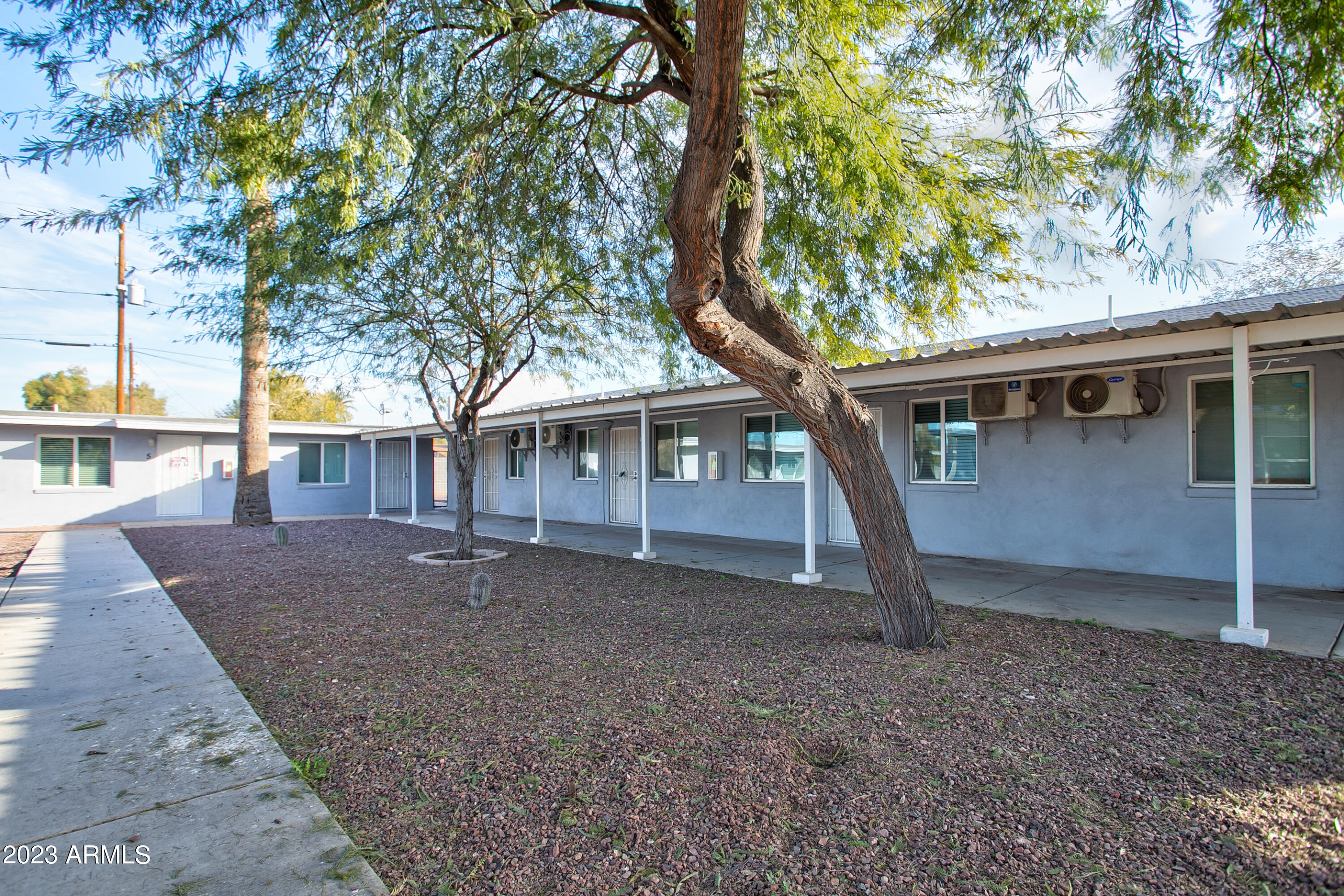 210 East Jones Avenue, Unit 2 Phoenix, AZ 85040 - Photo 6 of 27 a house with trees in front of it