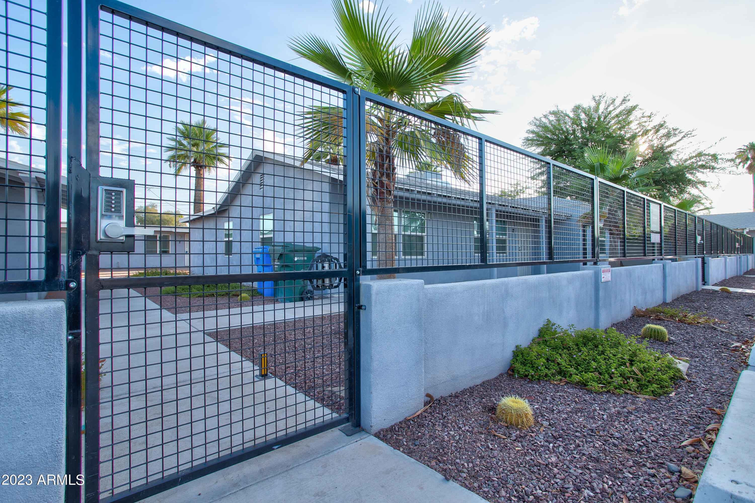 210 East Jones Avenue, Unit 2 Phoenix, AZ 85040 - Photo 9 of 27 a front view of a house with a garden