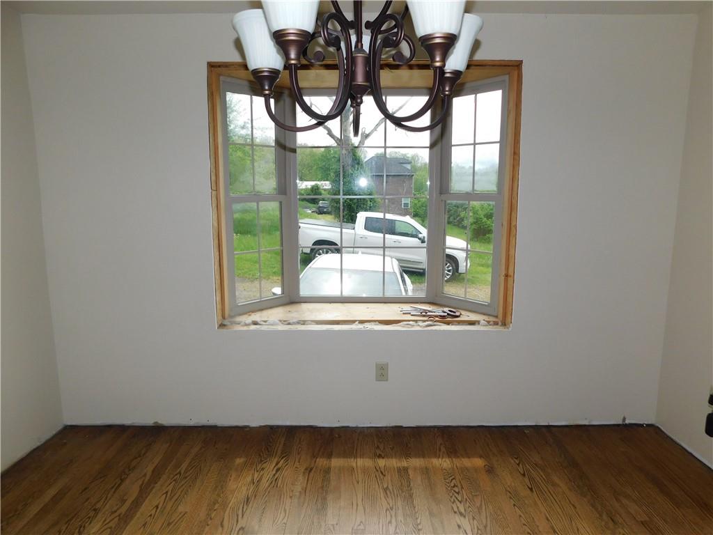 110 Holbert Stretch Dilliner, PA 15327 - Photo 13 of 27 a view of empty room with wooden floor and fan