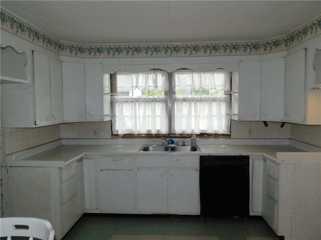 110 Holbert Stretch Dilliner, PA 15327 - Photo 25 of 27 a kitchen with a sink stove and cabinets