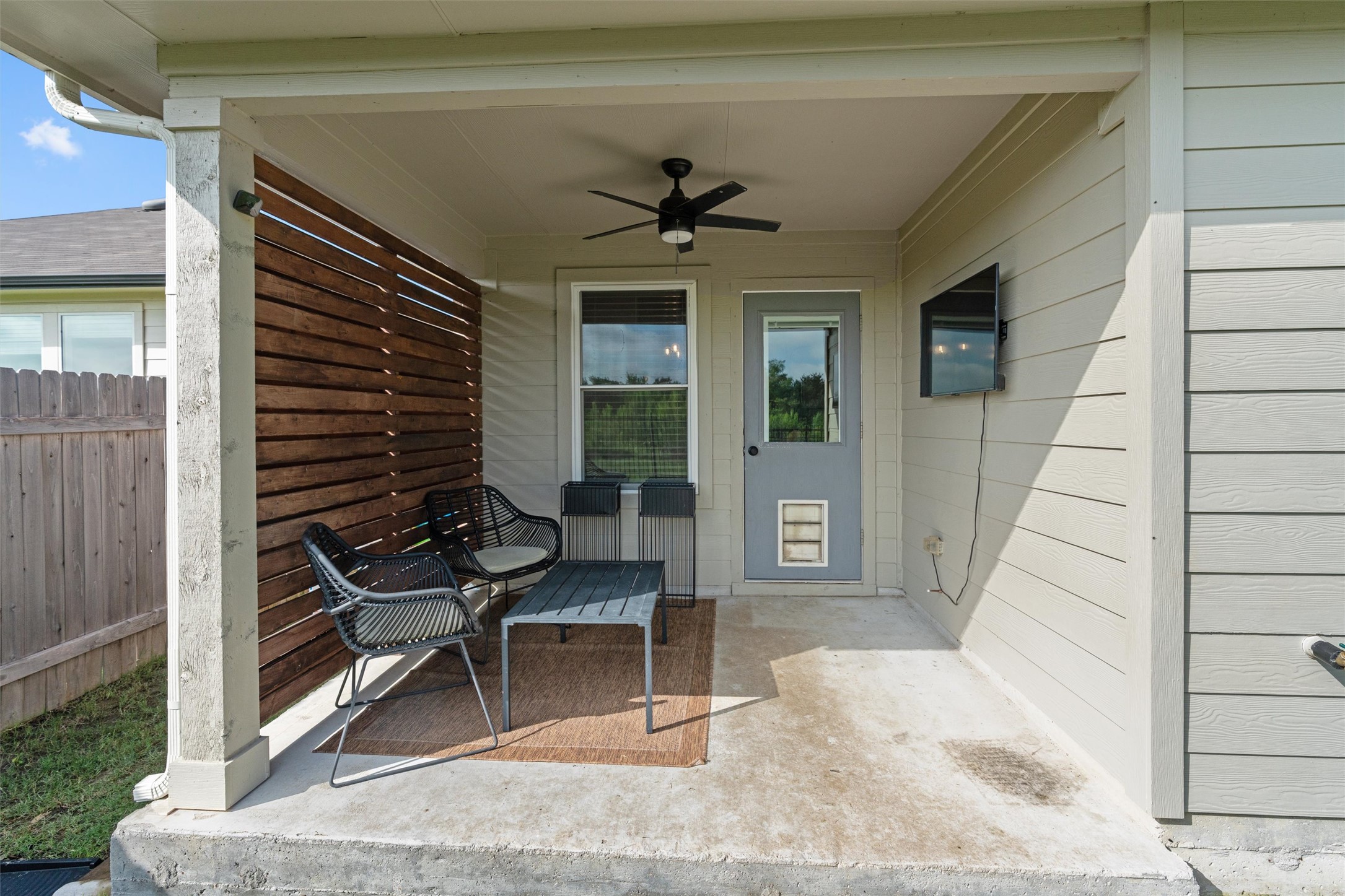 19912 Abigail Fillmore Road Manor, TX 78653 - Photo 24 of 31 A private covered patio offers an ideal space for outdoor relaxation and entertainment.