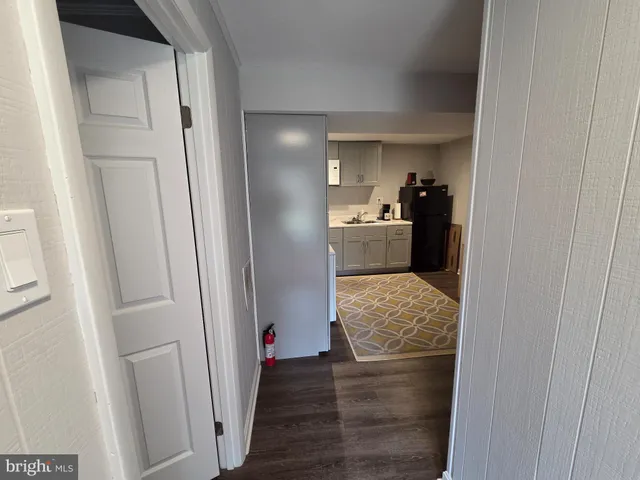 a view of hallway with wooden floor