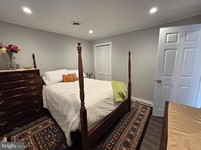 a bed room with a bed and a chandelier