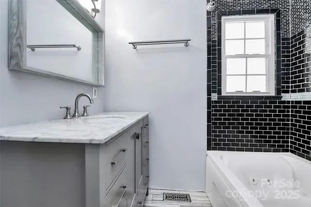 a bathroom with a bathtub and a sink