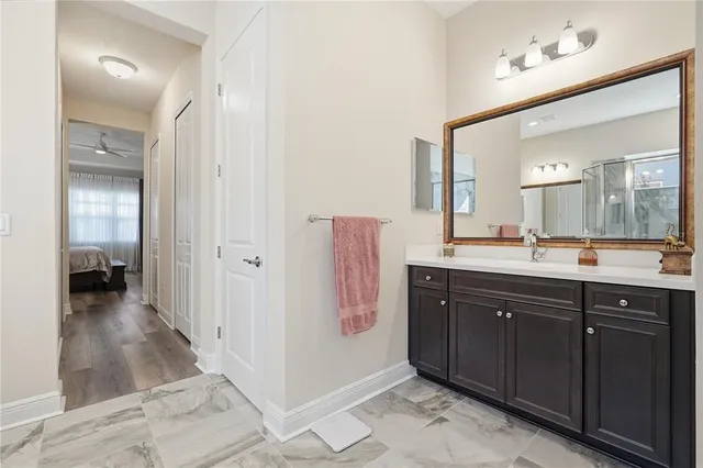 a spacious bathroom with a sink and a mirror