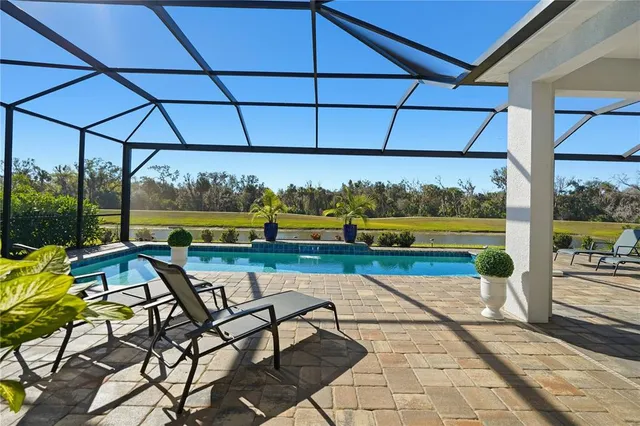 a view of swimming pool with seating space