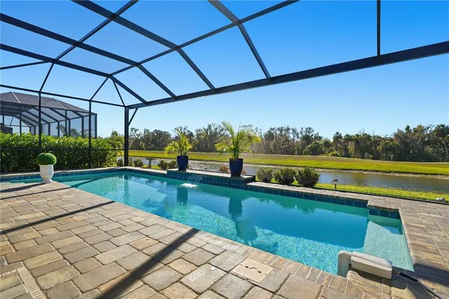 a view of a swimming pool with a patio