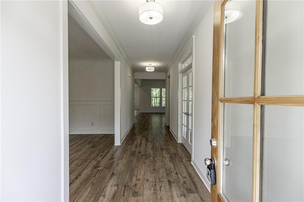 1210 Austin Road Winder, GA 30680 - Photo 6 of 56 a view of hallway with wooden floor