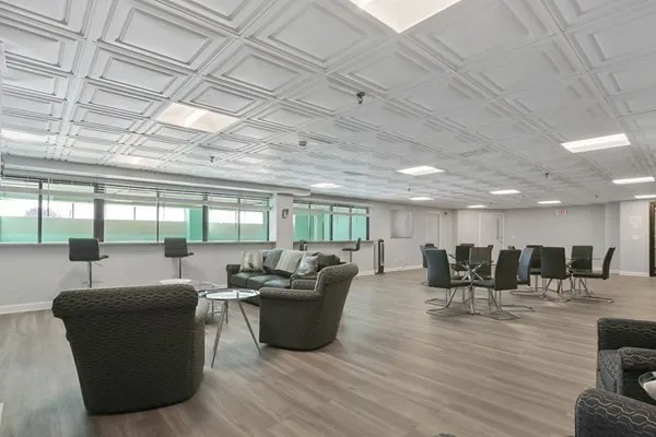 a lobby with furniture and a table